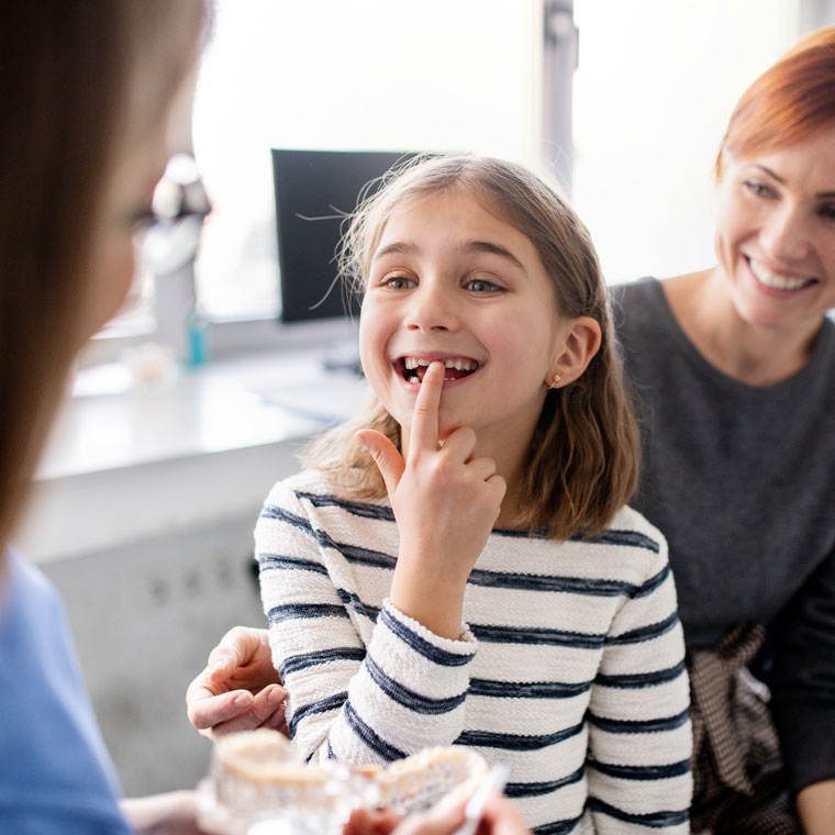 When should my child first
visit the orthodontist?